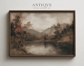May include: A framed landscape painting with a vintage aesthetic. The artwork depicts a serene lake scene with mountains in the background. The color palette is muted, featuring browns, greens, and grays. The frame is dark brown, and the text "ANTIOVE VINTAGE AESTHETIC ART" is at the top.