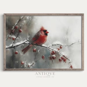 May include: A red cardinal perched on a snow-covered branch with red berries. The bird is in focus, while the background is blurred and painted in shades of gray and white.
