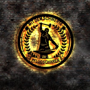 Letrero iluminado por LED con imagen de espadas a arados, emblema del logotipo iluminado