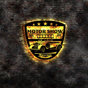 May include: A vintage car logo with the text "Motor Show" and "Old School Museum" in a yellow and black color scheme on a brick wall background.
