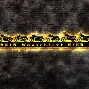 May include: A black metal sign with a row of motorcycle silhouettes and the text "DEIN WUNSCHTEXT HIER!" in yellow.