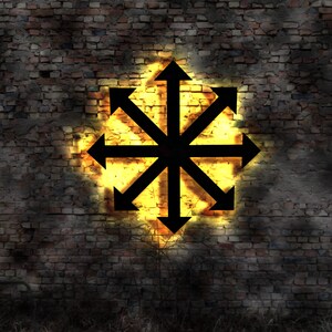 May include: A black eight-pointed star with arrows pointing outwards, illuminated by a bright yellow light, against a dark brick wall background.