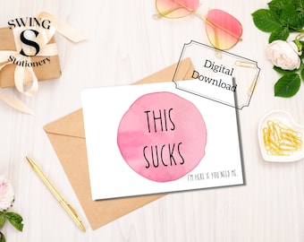 May include: A digital download card with a pink watercolor circle and the text "This Sucks" in black. The card also includes the text "I'm here if you need me."