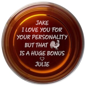 May include: A brown glass coaster with the text "Jake I love you for your personality but that is a huge bonus heart Julie" engraved on it.