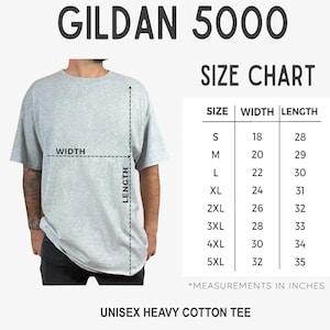 May include: A light gray Gildan 5000 unisex heavy cotton tee shirt with a size chart. The chart shows measurements in inches for sizes S to 5XL, with widths from 18 to 32 inches and lengths from 28 to 35 inches.