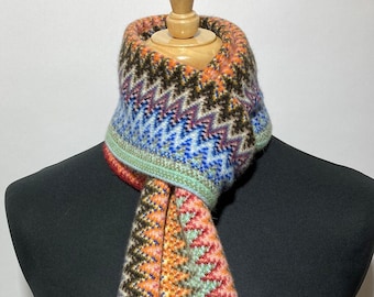 Lambswool warp knitted scarf in multi colour zigzag pattern. Designed and Made in Scotland