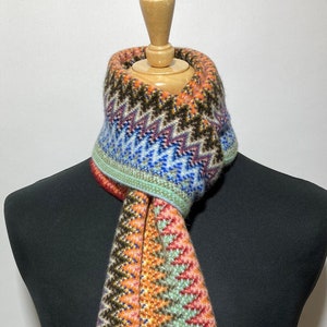 Lambswool warp knitted scarf in multi colour zigzag pattern. Designed and Made in Scotland