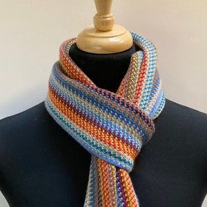 Cashmere warp knitted scarf in contemporary multi colour stripes. Designed and Made in Scotland