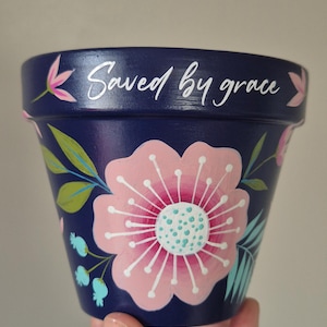 Handpainted 11cm terracotta pot - floral design - Saved by grace