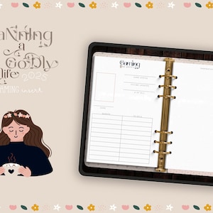 May include: A planner insert with the text "Planning a Godly Life 2025 GAMING insert." The insert has a black frame and gold rings. The insert includes sections for game status and future address. A cartoon illustration of a woman holding a mug is also present.