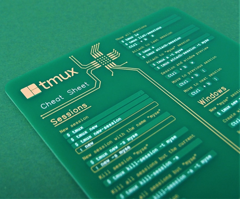 May include: A green cheat sheet with gold text for the tmux terminal multiplexer. The cheat sheet includes commands for creating, attaching to, and managing tmux sessions and windows.