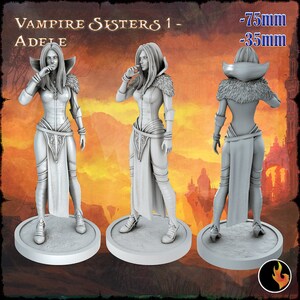 May include: A white painted miniature figurine of a female vampire with long hair and a flowing gown. The figurine is standing on a round base. The text "Vampire Sisters 1 - Adele" is visible at the top of the image. The text "75mm - 35mm" is visible in the top right corner of the image.