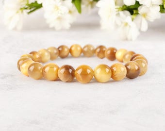 Bracelet unisexe en œil de tigre doré : Bijou de protection et de guérison, idéal comme cadeau.