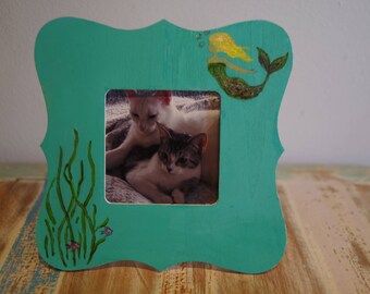 Hand-painted coastal, mermaid themed wooden picture frame, for 3.7 x 3.7 inch pictures.