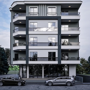 May include: A contemporary multi-storey building with a grey and white facade, glass balconies, and large windows. Two cars are parked in front. The sky is overcast.