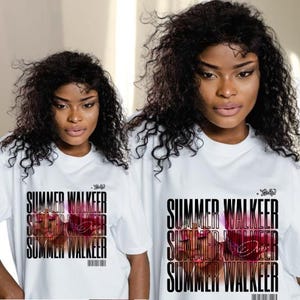 May include: Two women wearing white t-shirts with the text "SUMMER WALKER" in a stacked design. The text is black with a pink and purple image overlay. The shirts have a barcode at the bottom.