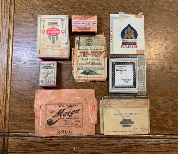 Vintage tobacco labels from Latvia in a cigar box