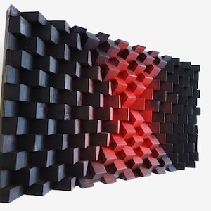 Puede incluir: Una escultura de pared hecha de bloques de madera, pintados de negro y rojo. Los bloques están dispuestos en un patrón que crea una sensación de profundidad y movimiento. La escultura es una pieza de arte moderna y abstracta.