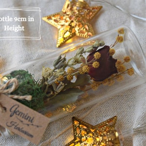 Bottle is miniature in size, about 9cm tall. The flowers are professional preserved and will last for a long time.