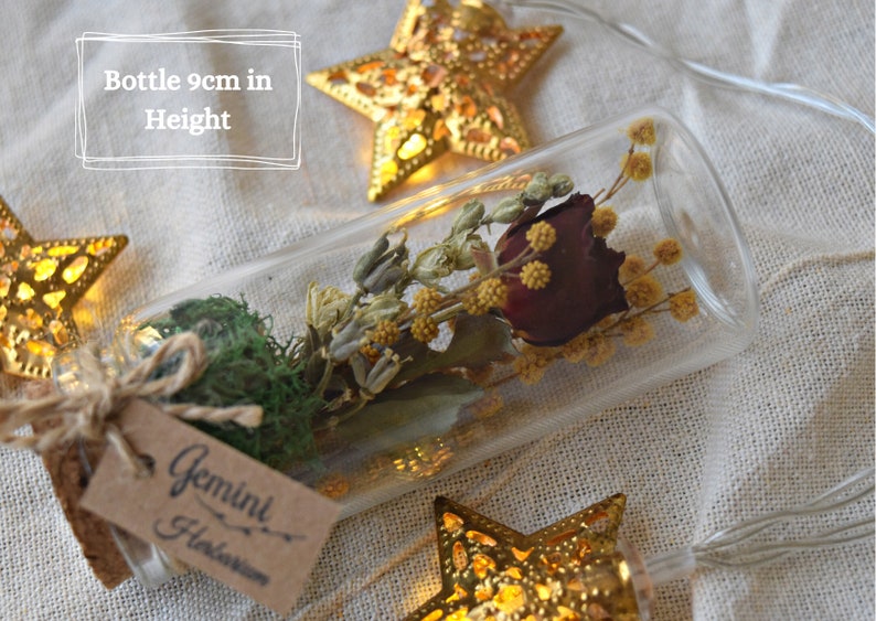 Bottle is miniature in size, about 9cm tall. The flowers are professional preserved and will last for a long time.