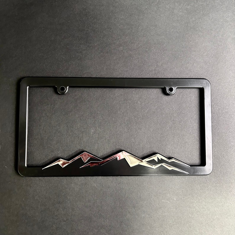 Shiny Chrome Mountains Plastic License Plate Frame image 1