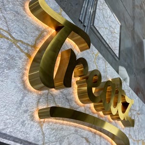 Gold brushed custom backlit sign silver brushed letters , stainless steel sign