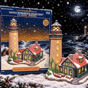 May include: A Santa's Workbench Collection lighted porcelain house titled Cape Christiana. The set includes a stone-textured lighthouse with a glowing lantern room and a gray cottage with a red roof, both featuring snow-dusted details and a small boat.