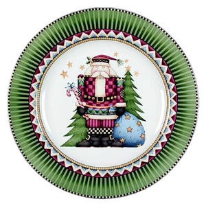 May include: A round Christmas plate with a green and white striped border. The center features a Santa Claus illustration with a candy cane, Christmas tree, and a blue sack of gifts. The plate has a decorative design with stars.