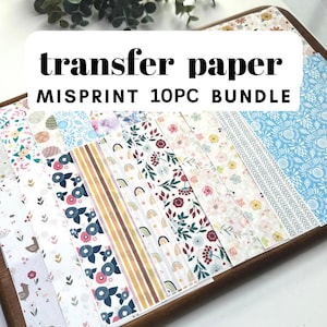 May include: A 10-piece bundle of transfer paper sheets featuring various patterns including floral prints, rainbows, stripes, and chevron designs. The text "transfer paper MISPRINT 10PC BUNDLE" is overlaid on the collection of colorful patterned sheets.