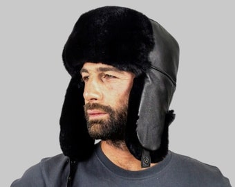 Zwarte Rex trapperhoed, herenbontmuts. Een Russische ushanka-hoed met zacht lamsleer en zacht zwart rexbont. Goede pasvorm, warme bontmuts