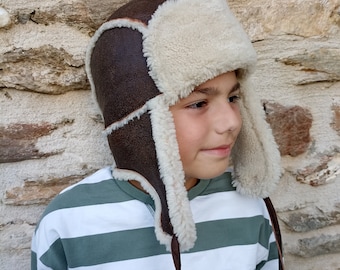 Brown trapper hat , lambskin hat for boys & girls with earflaps . Practical, soft and light hat that offers natural warmth and style