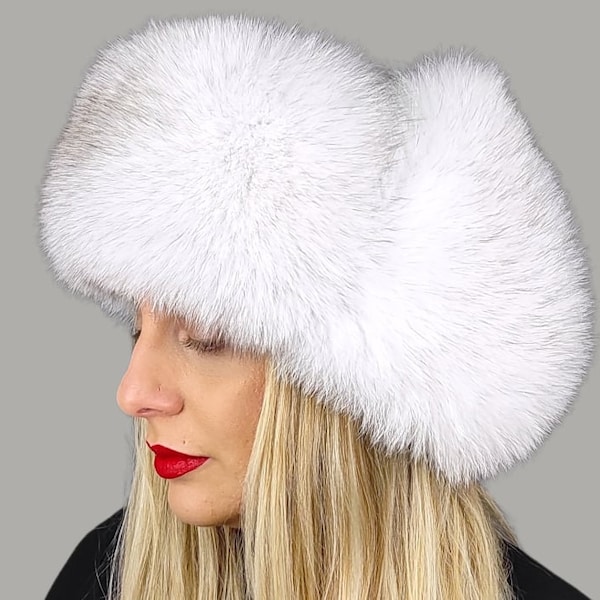 Carie Lynn Fur hat . Blue fox fur hat with white leather . Women's fashionable fox trapper hat. Great fit , extremely fancy hat .