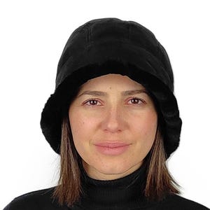 A black sheepskin cloche hat for women . Unique in style , superb sense , great fit. Gift idea for her