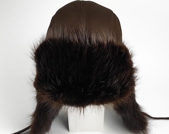 The ultimate trapper hat. Beaver hat with earflaps & leather strings.Dark brown long-haired beaver, dark brown sheepskin. Great gift for him