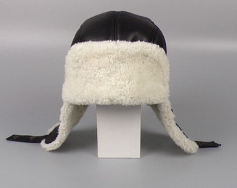 Sheepskin trapper hat in black & white . A napalan sheepskin hat with earflaps and holes .Great fit , gift idea for him