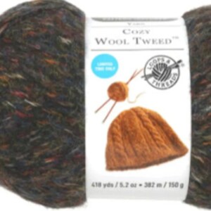 May include: A skein of Loops & Threads Cozy Wool Tweed yarn in a brown, black, and blue colorway. The yarn is a blend of wool and acrylic and is 418 yards / 5.2 ounces. The label also shows a knitted hat in a brown color.