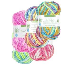 May include: Three skeins of yarn in different color combinations. The yarn is a chunky, bulky weight and is made of recycled materials. The yarn is labeled "Eco Tie Dye" and "Teinture au Noeud Eco".