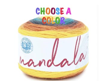 May include: A skein of Lion Brand Mandala yarn in a multi-colored ombre pattern. The yarn is yellow, orange, red, purple, blue, and green. The label says "Choose a Color" and "mandala".