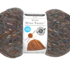 May include: A skein of Cozy Wool Tweed yarn in a multi-colored tweed pattern. The yarn is a blend of wool and acrylic and is machine washable. The skein is 418 yards / 382 meters and is 100 grams. The label also includes a pattern for a hat.