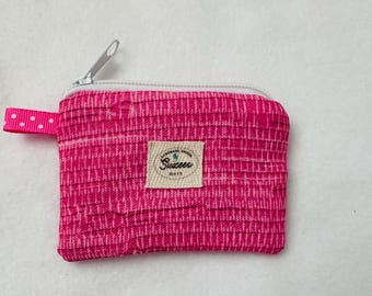 Mini bolsa de tela acolchada para monedas con cremallera.
