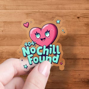 May include: A sticker featuring a pink heart character with blue eyes and the text "404: No Chill Found" in teal. The sticker has a light brown border with small stars and hearts. The sticker is held by a hand.