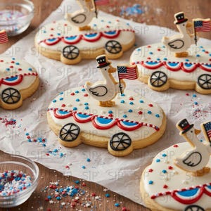 May include: Cookies decorated with white icing, red, white, and blue accents, and a duck wearing a hat holding an American flag. The cookies are shaped like a wagon with black wheels and are decorated with sprinkles.