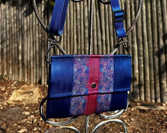 The Foldover Crossbody Clutch Seat Belt Bag in Royal Blue and Pink Floral