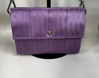 The Foldover Crossbody Clutch Seat Belt Bag in Lilac