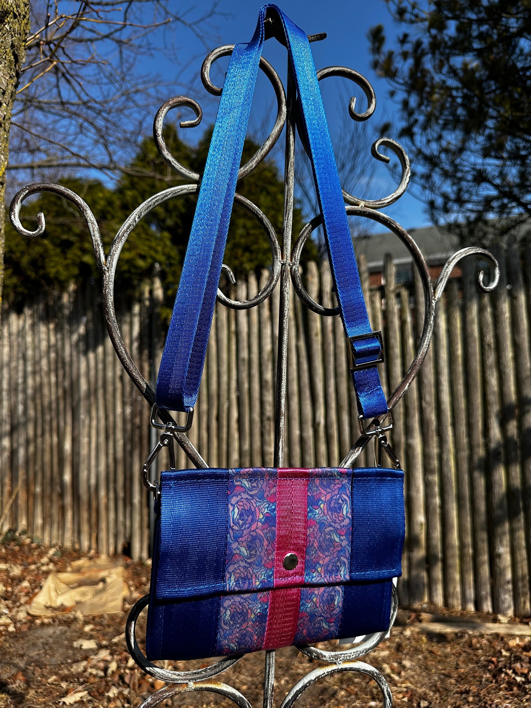 The Foldover Crossbody Clutch Seat Belt Bag in Royal Blue and Pink Floral
