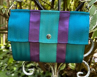Foldover Crossbody Clutch Seat Belt Bag in Peacock, Teal and Purple