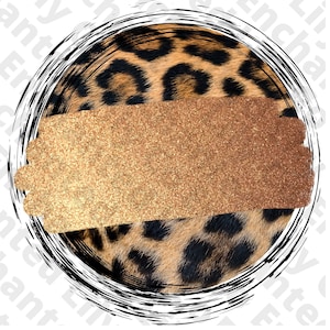 May include: A circular design featuring a leopard print pattern with a gold glitter overlay. The design is surrounded by a black and white circular brushstroke.