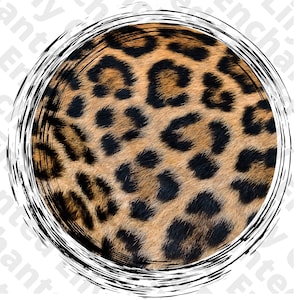 May include: Close-up of a leopard's fur with a black and brown spotted pattern. The fur is soft and fluffy, and the spots are irregular in shape and size.