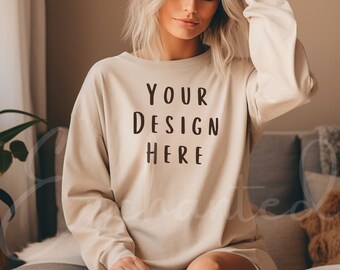 May include: A beige sweatshirt with the text "YOUR DESIGN HERE" printed on the front.