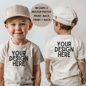 May include: A child wearing a beige t-shirt with the text "YOUR DESIGN HERE" printed on the front and back. The child is also wearing a beige baseball cap. Includes 3 mockup photos: front, back, and front + back.